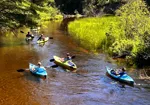 Kayayers paddling on a beautiful river